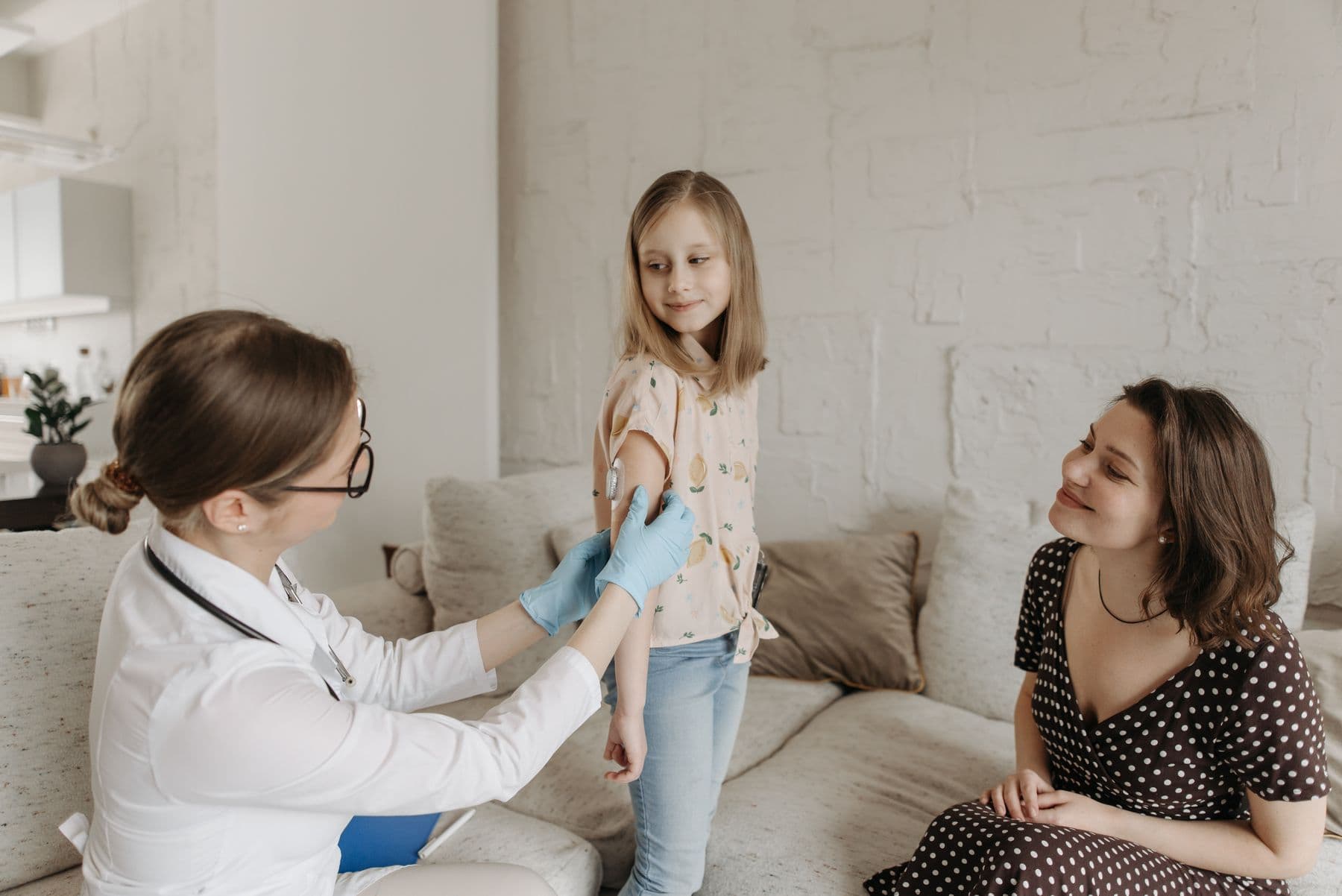 A parent with her child during a health check-up