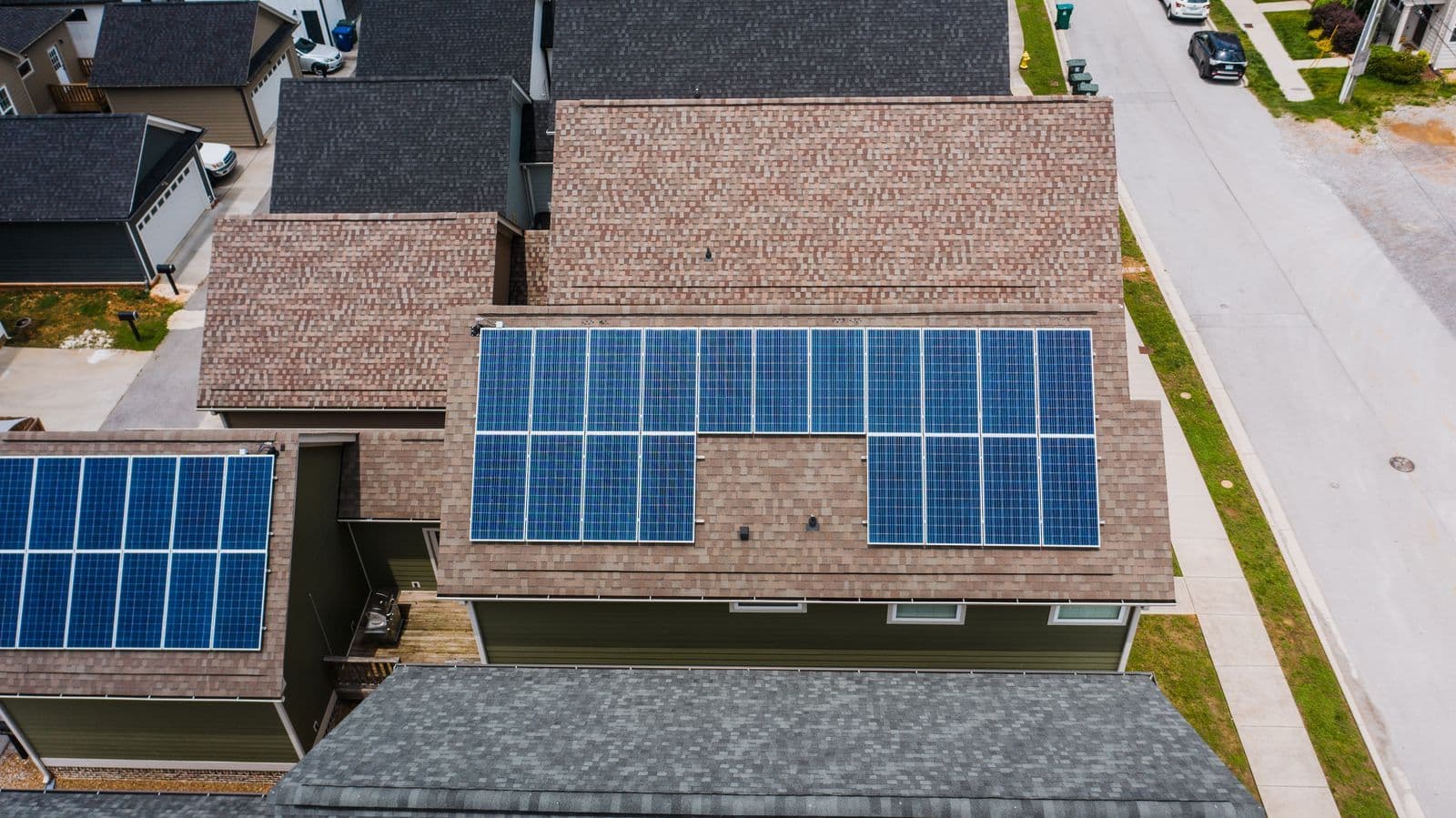 Solar panels fitted across a tiled house roof