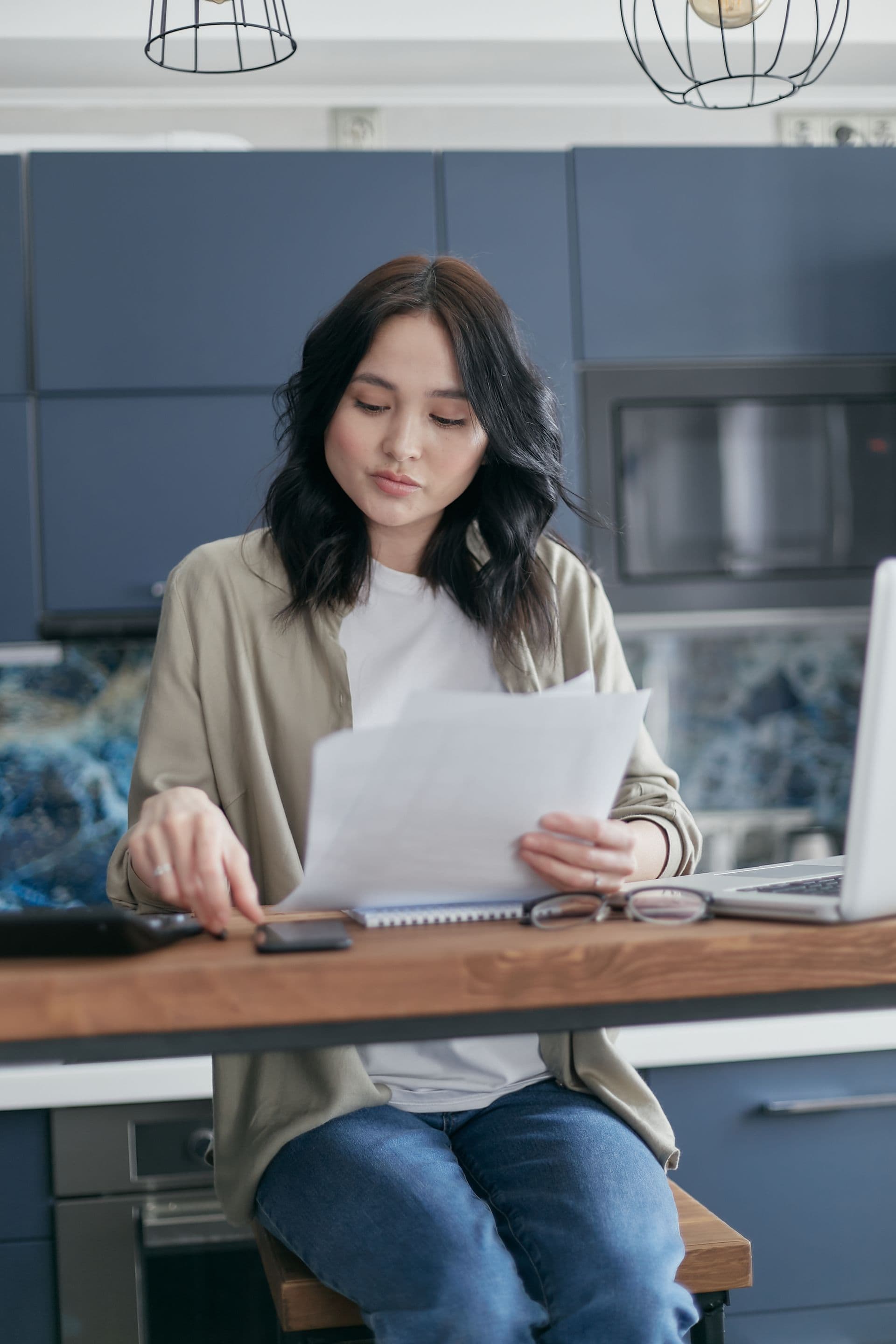 Couple checking household costs on a laptop while considering an NBN price lock