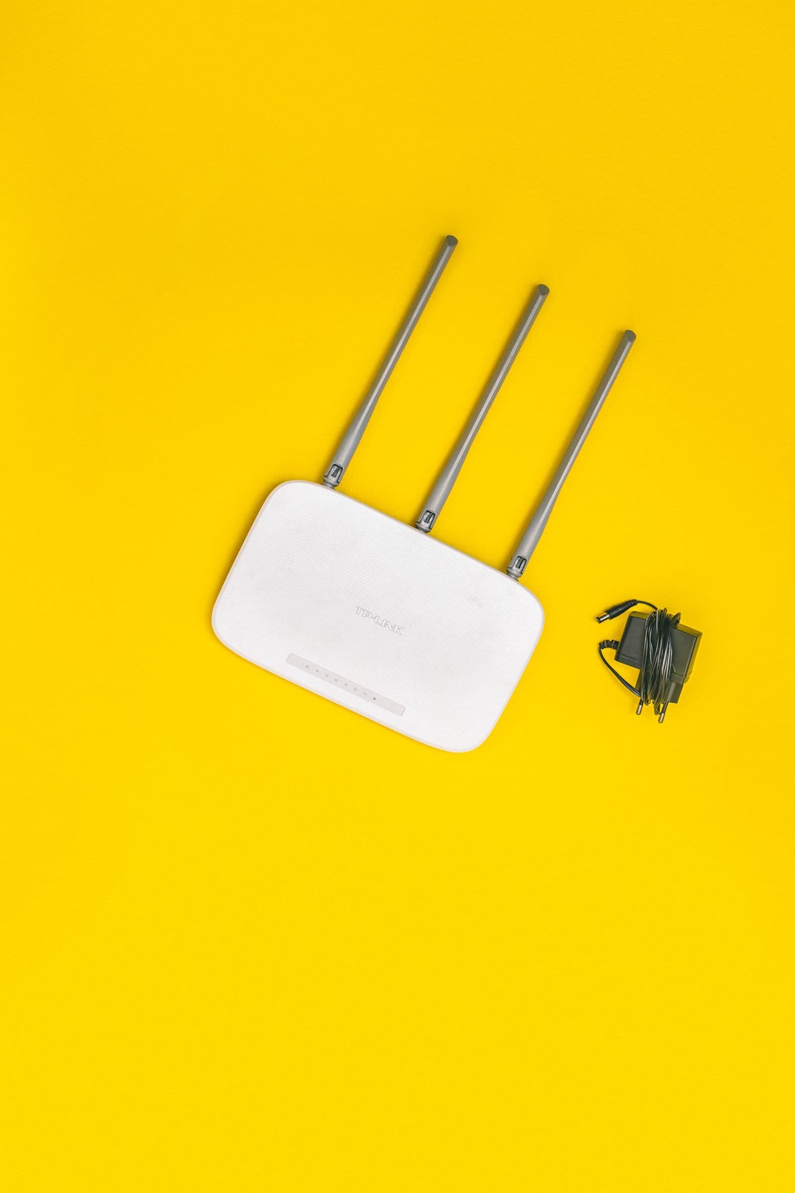 Wi-Fi router on a table for an Aussie Broadband versus Superloop comparison guide.