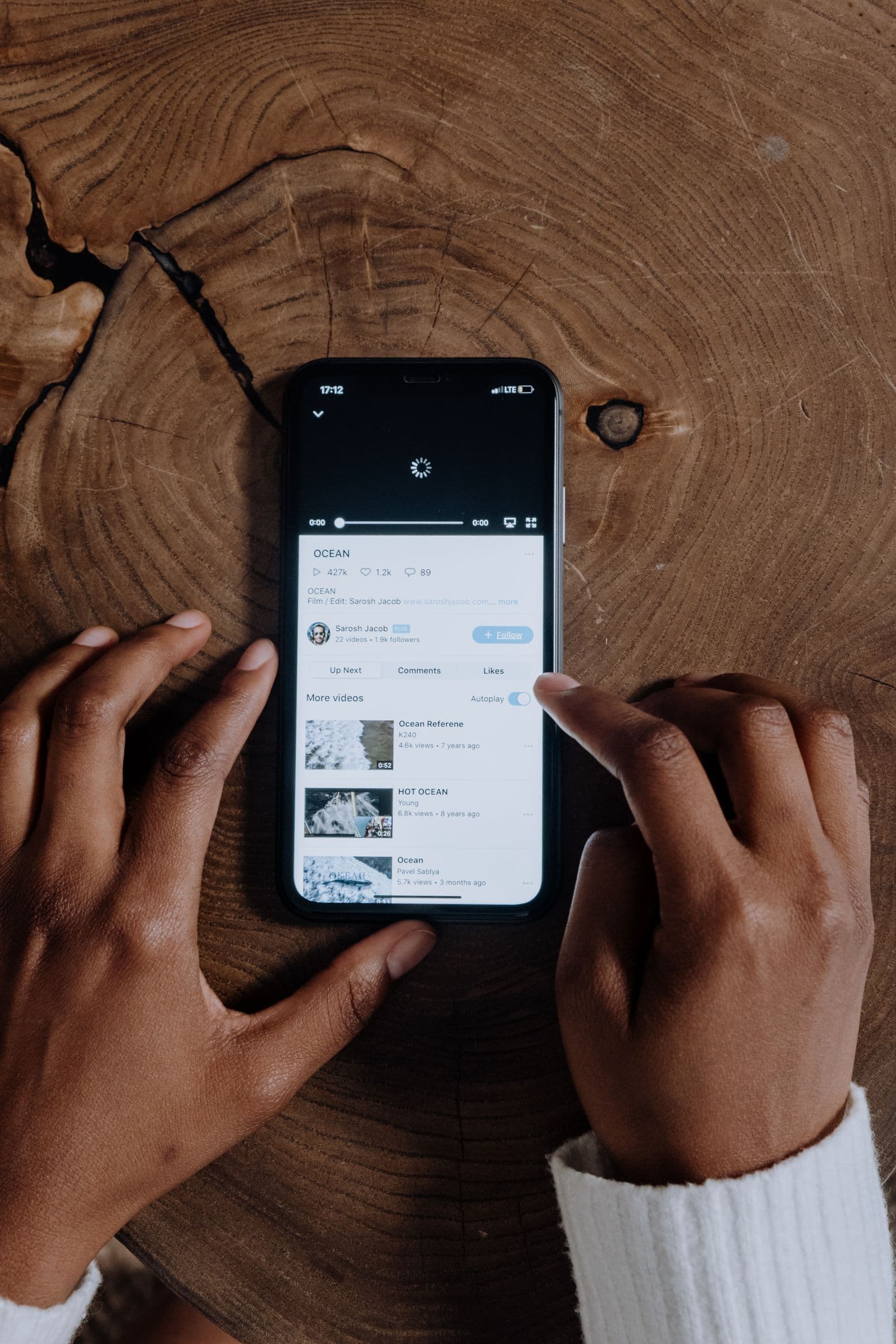 Person streaming video on a smartphone using mobile data