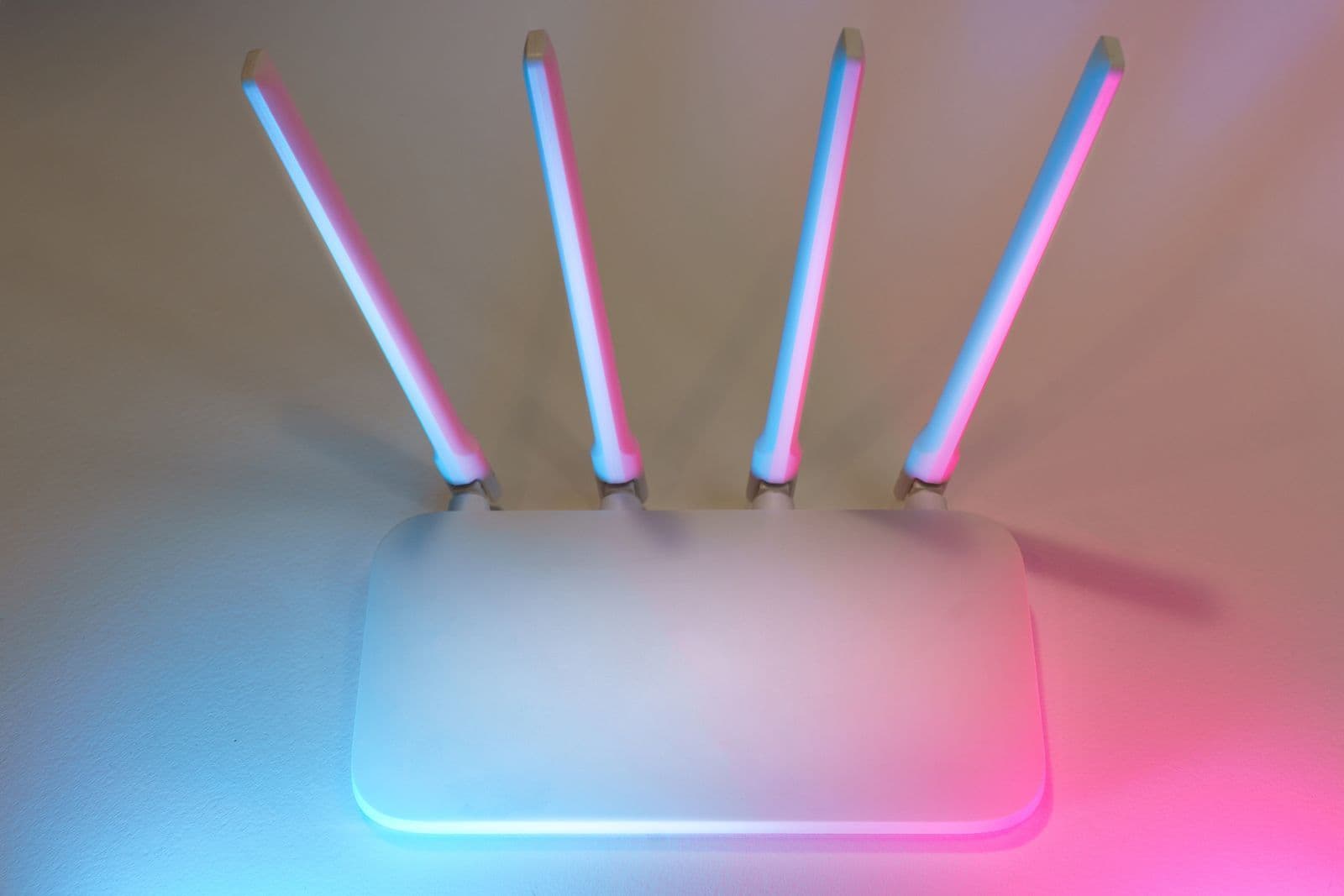 Person reconnecting an existing Wi-Fi router during an internet switch