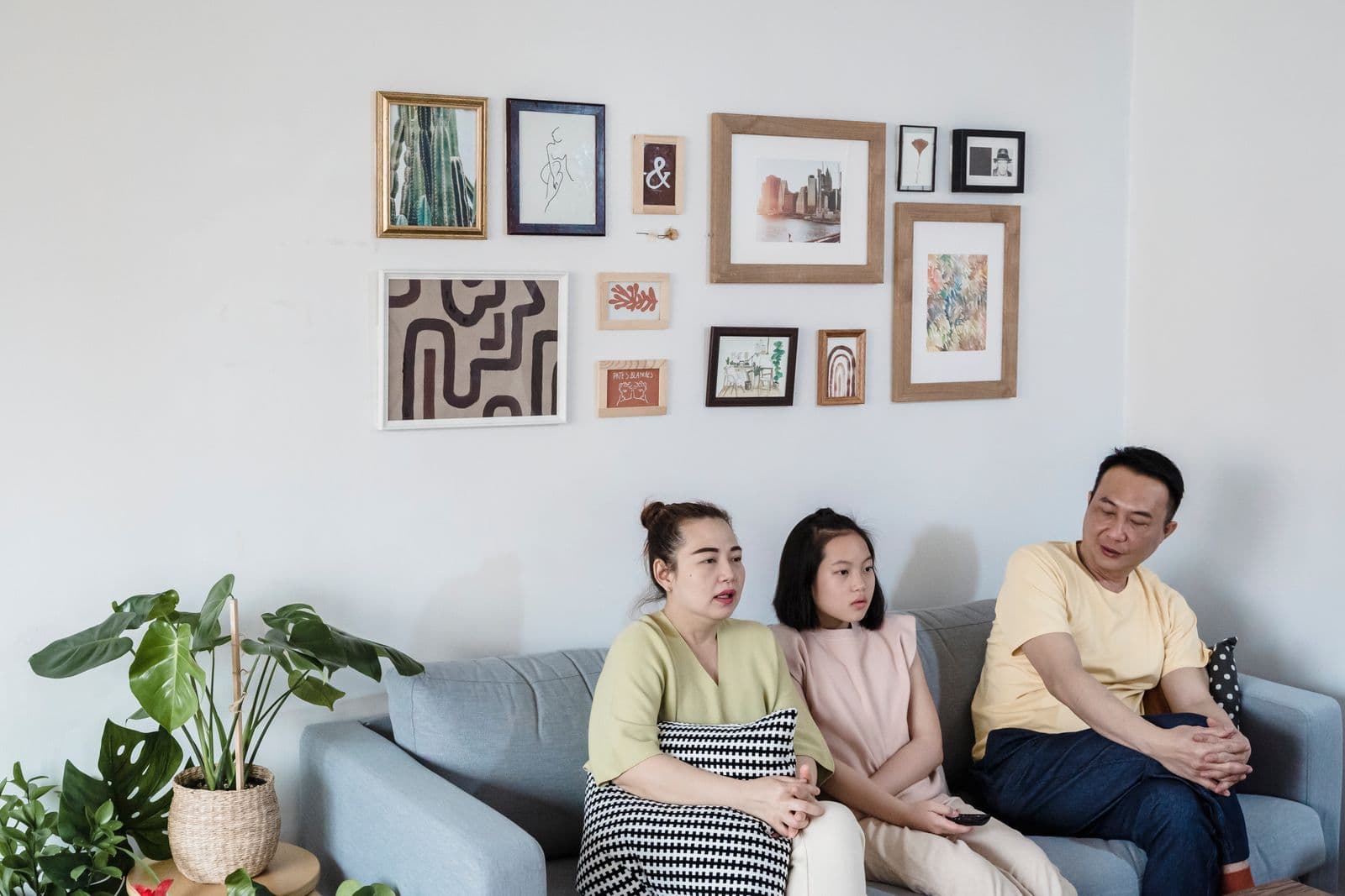 Family spending time together on a living-room sofa