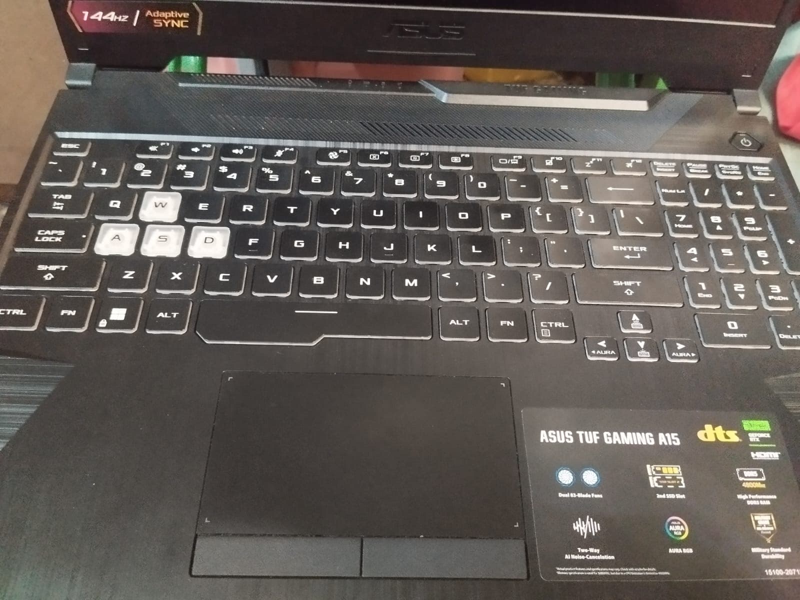 Real laptop photograph representing download and upload activity on a home connection