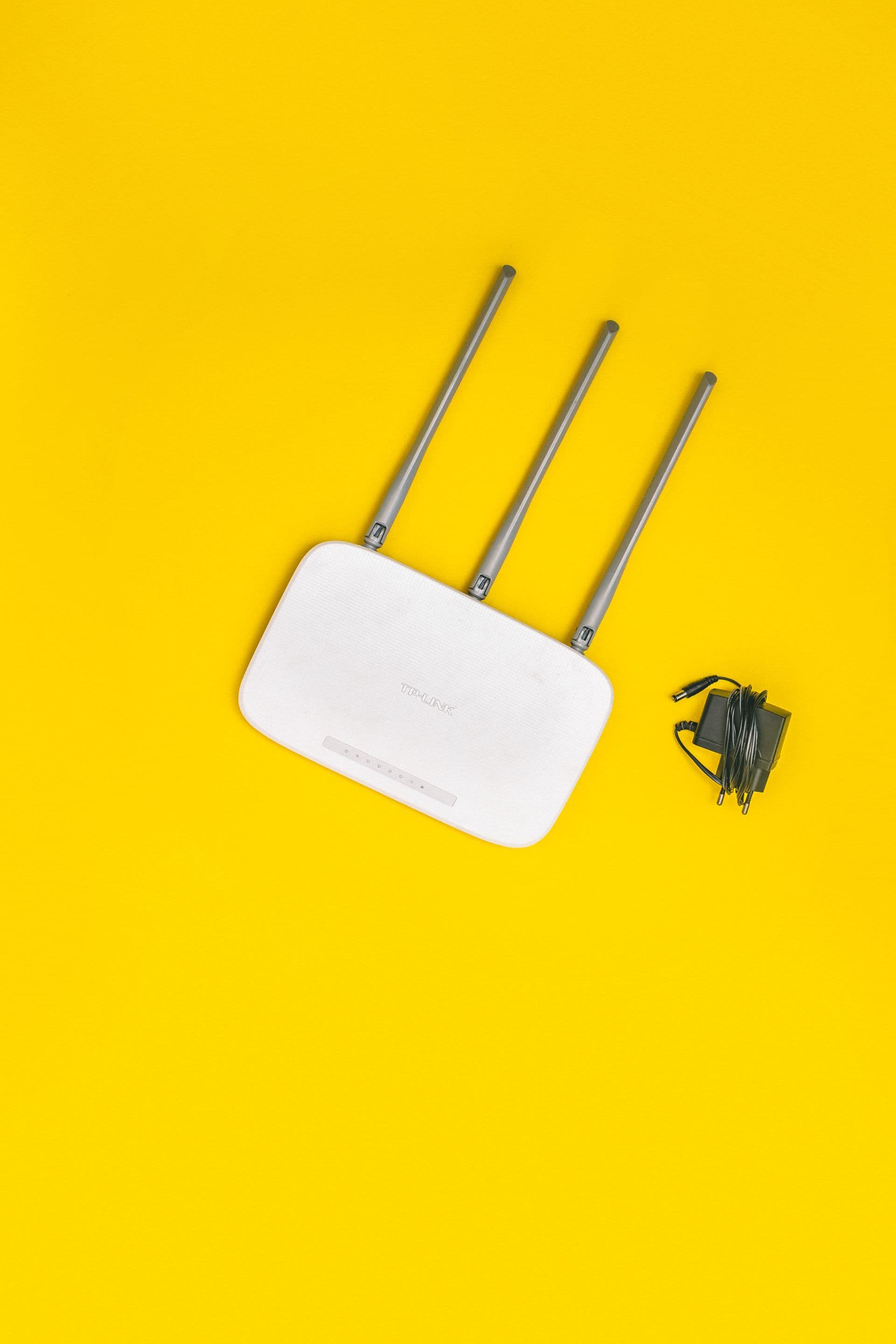 Physical internet modem photographed on a table for an ownership cost comparison