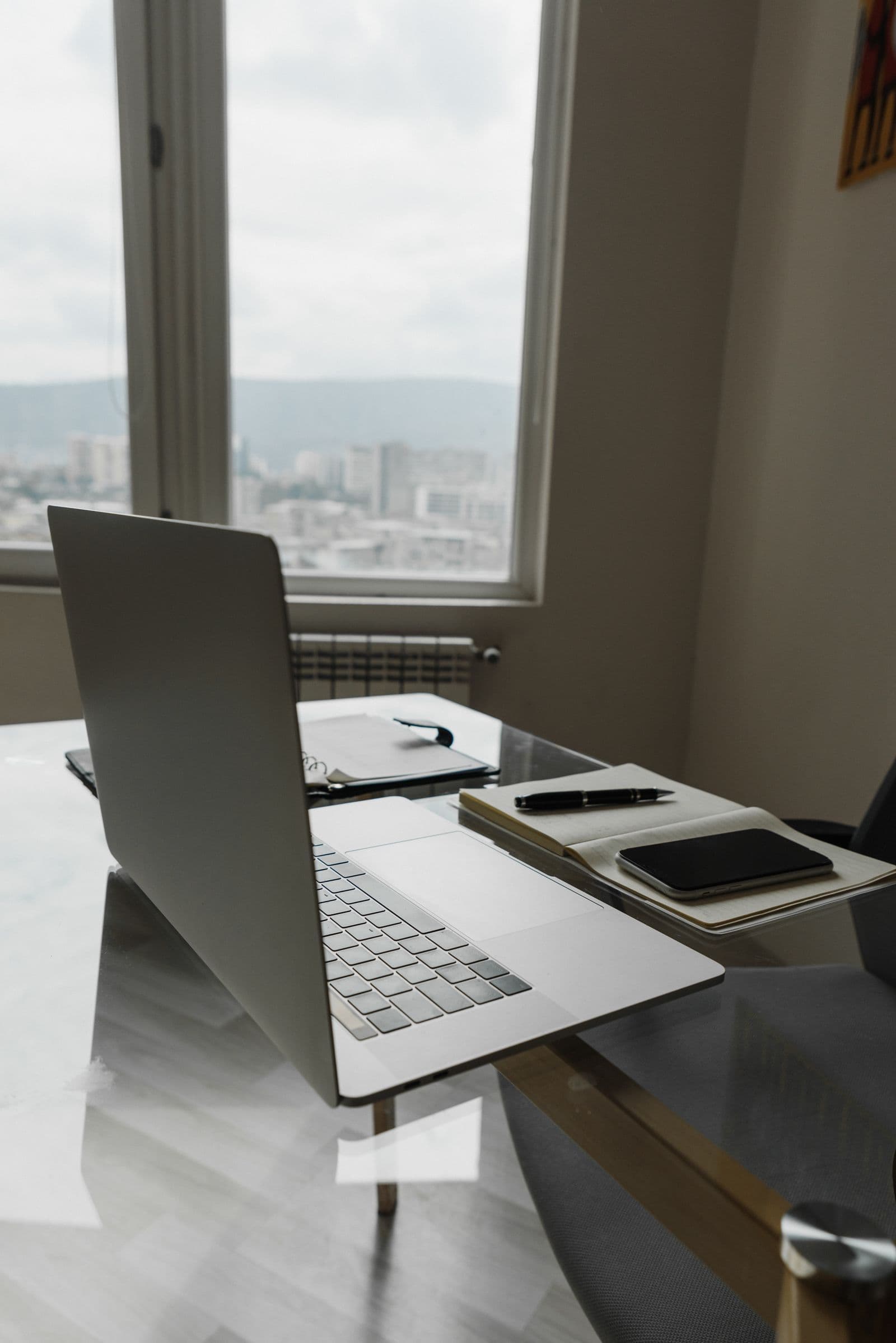 Laptop and mobile phone on a home-office desk
