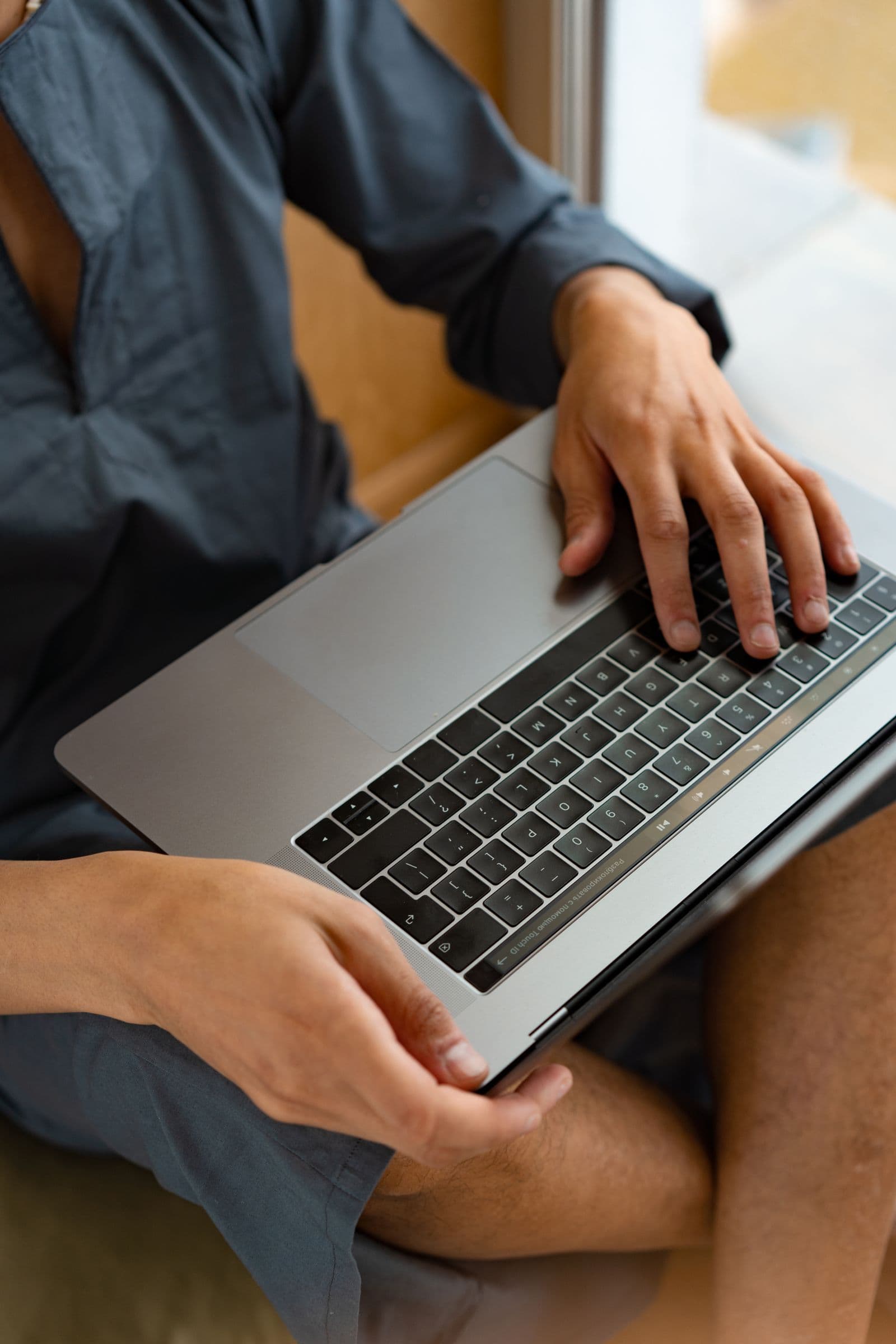 Single Australian comparing health insurance on a laptop