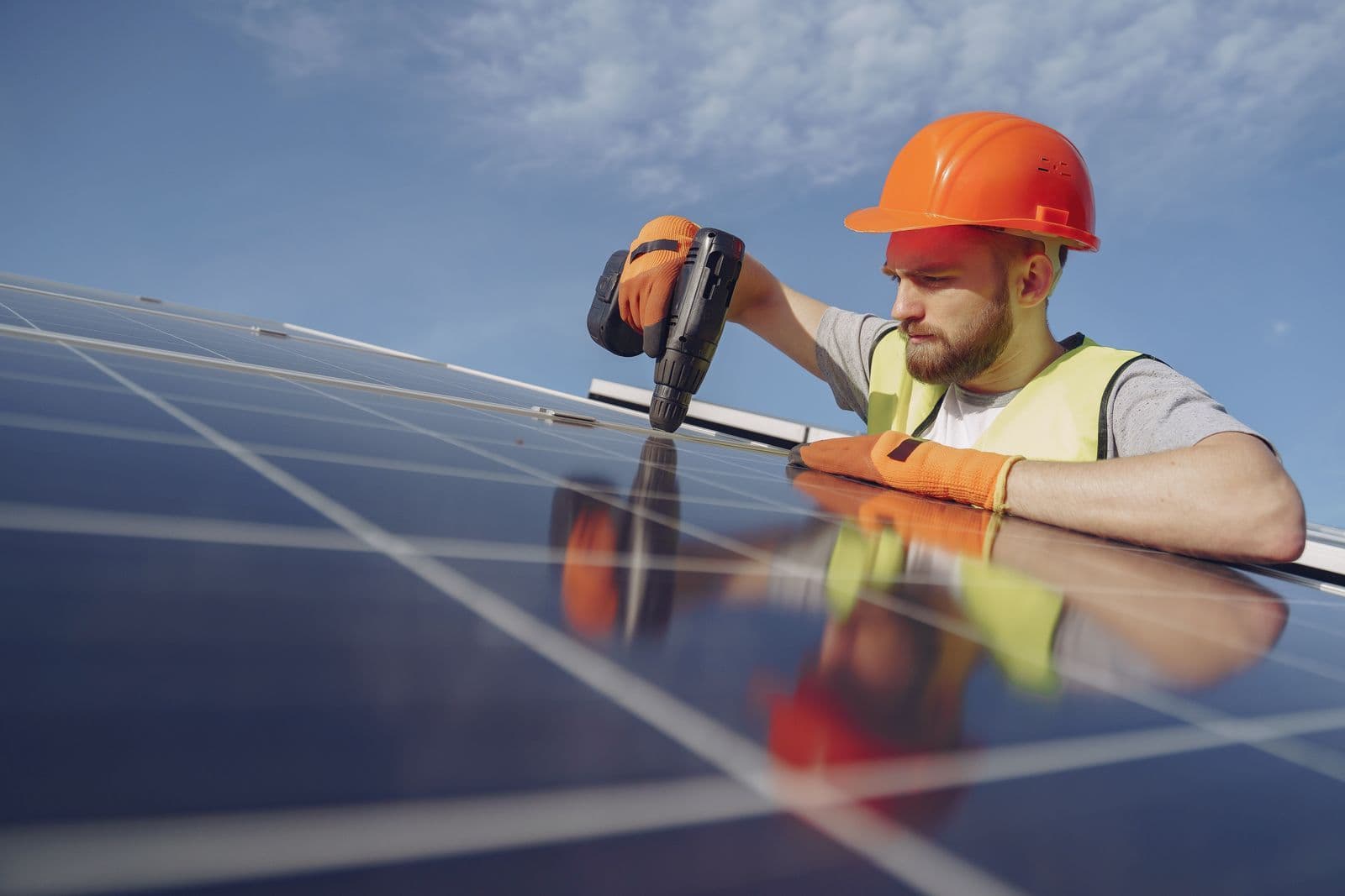 Homeowner reviewing a solar battery installation quote at a table