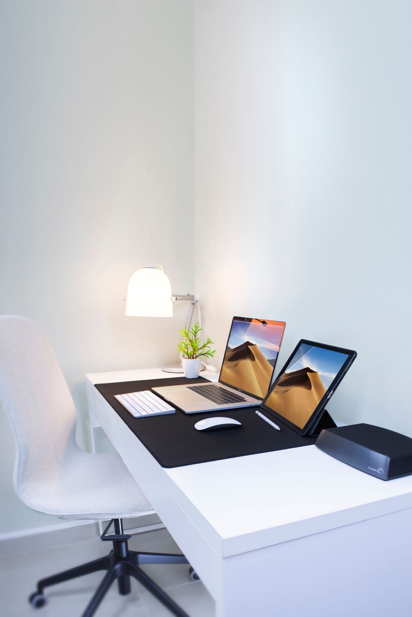 Home internet router beside contract paperwork and a laptop