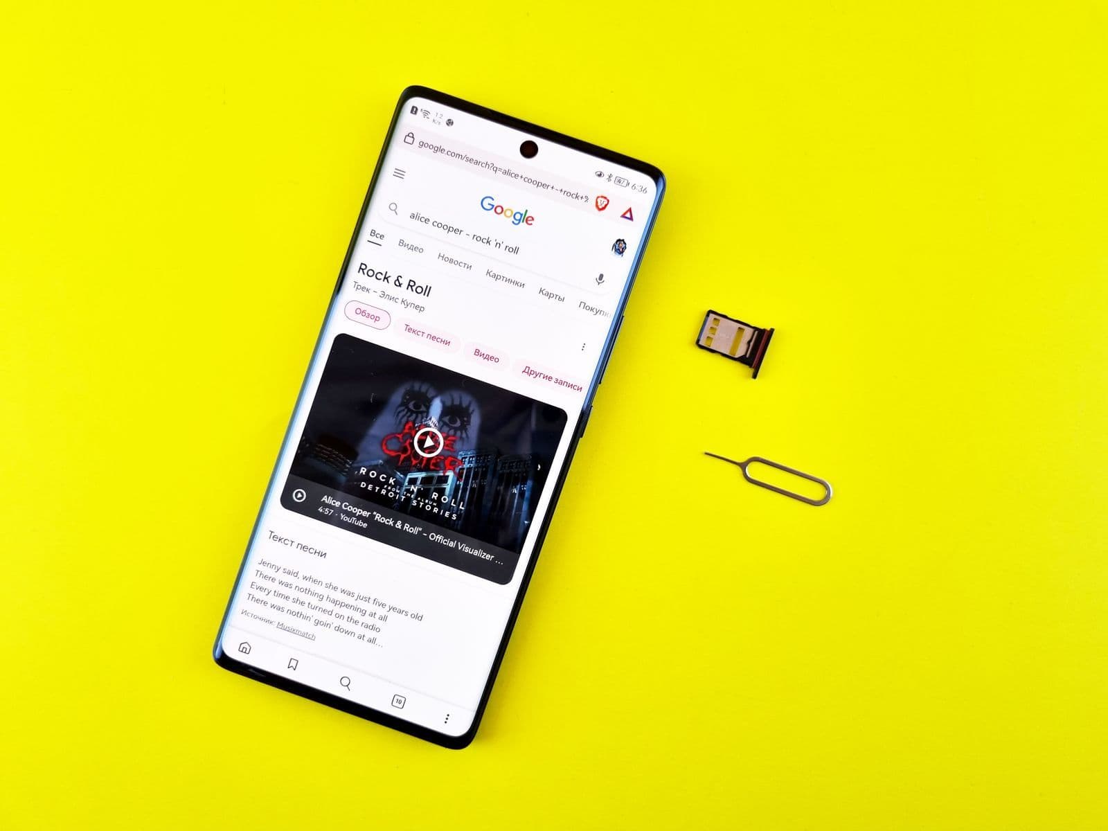 Person preparing a pay-as-you-go SIM card for a smartphone