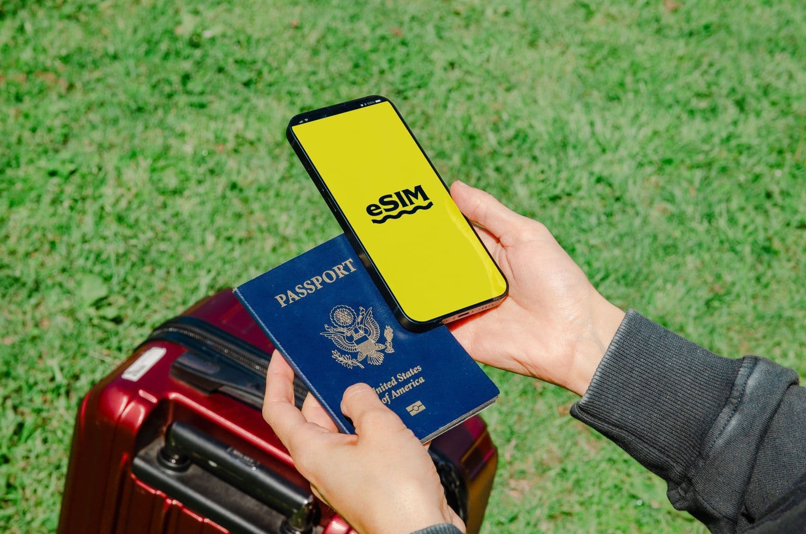 Traveller setting up an eSIM on a smartphone at an airport