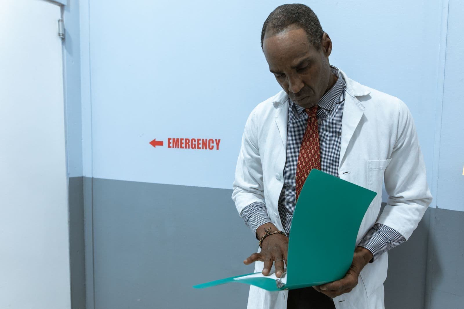 A healthcare professional reading a document