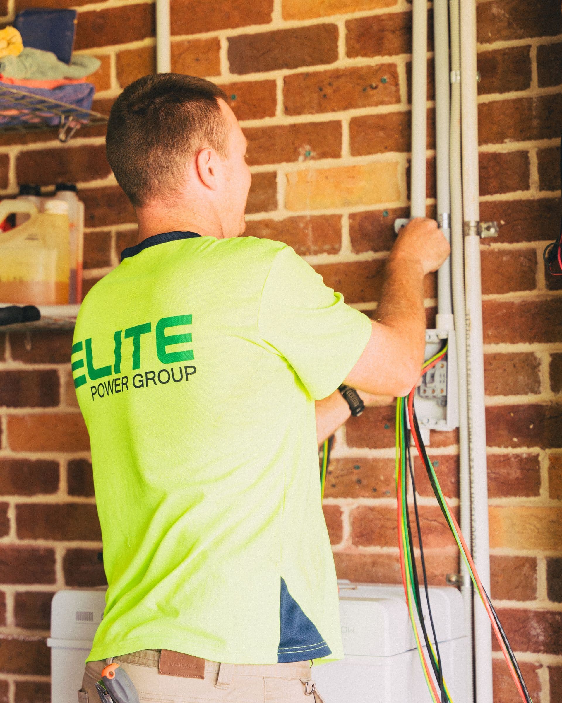 Qualified technician installing cables inside a residential property
