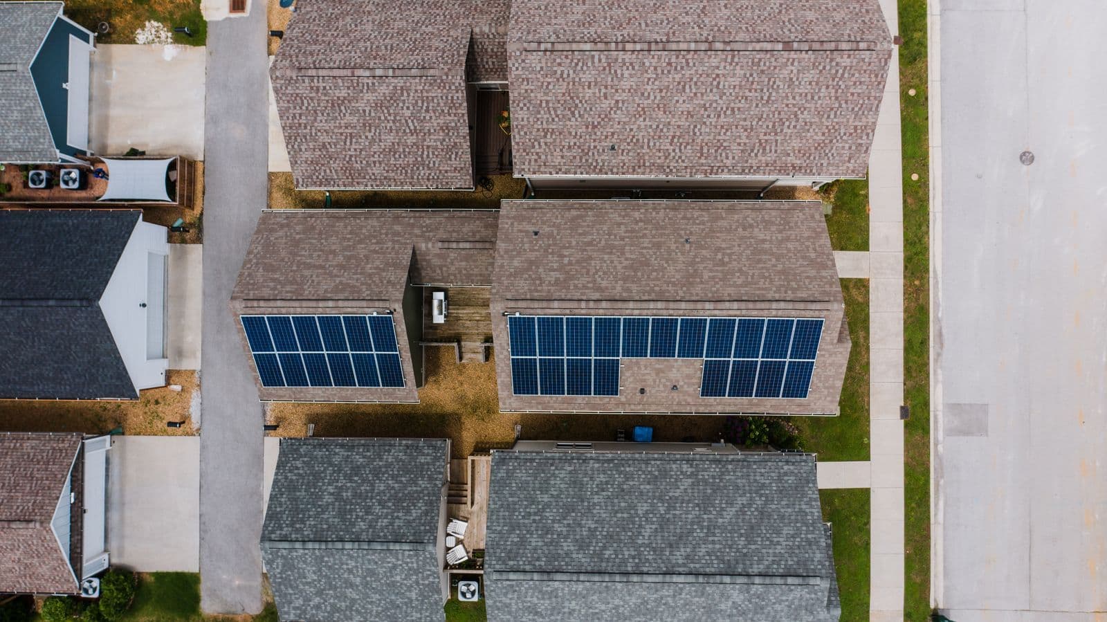 Aerial photograph of residential roofs with solar panels