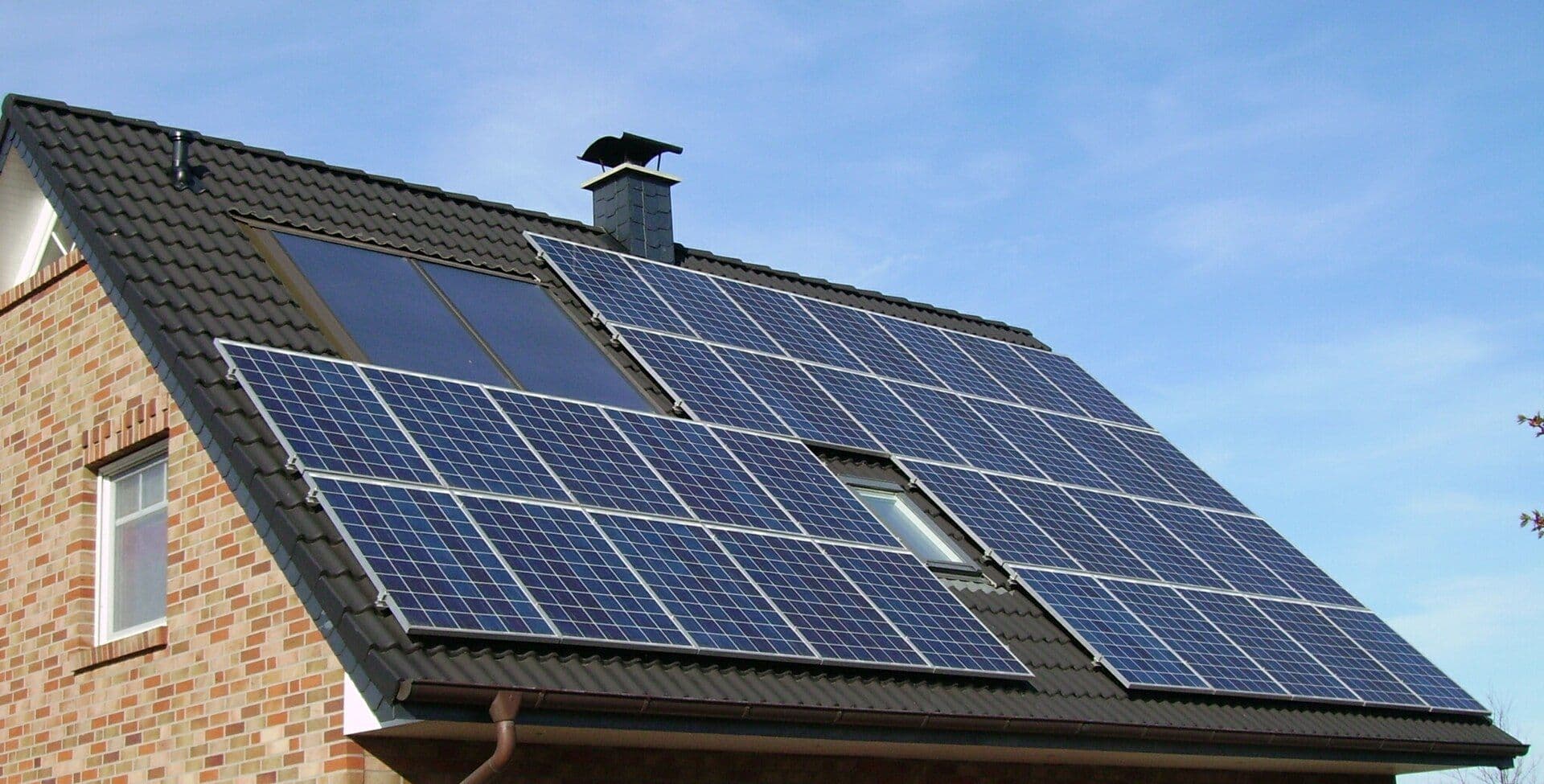 Solar panels on a roof for a free midday electricity guide